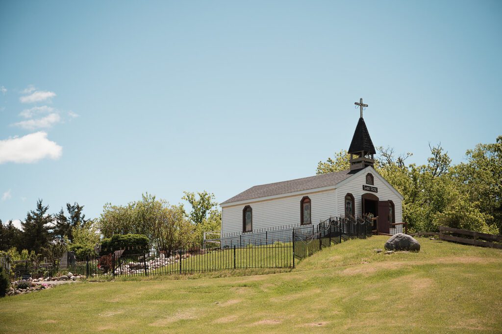 St. Rose Chapel on its lawn under open sky at Jennings Holler