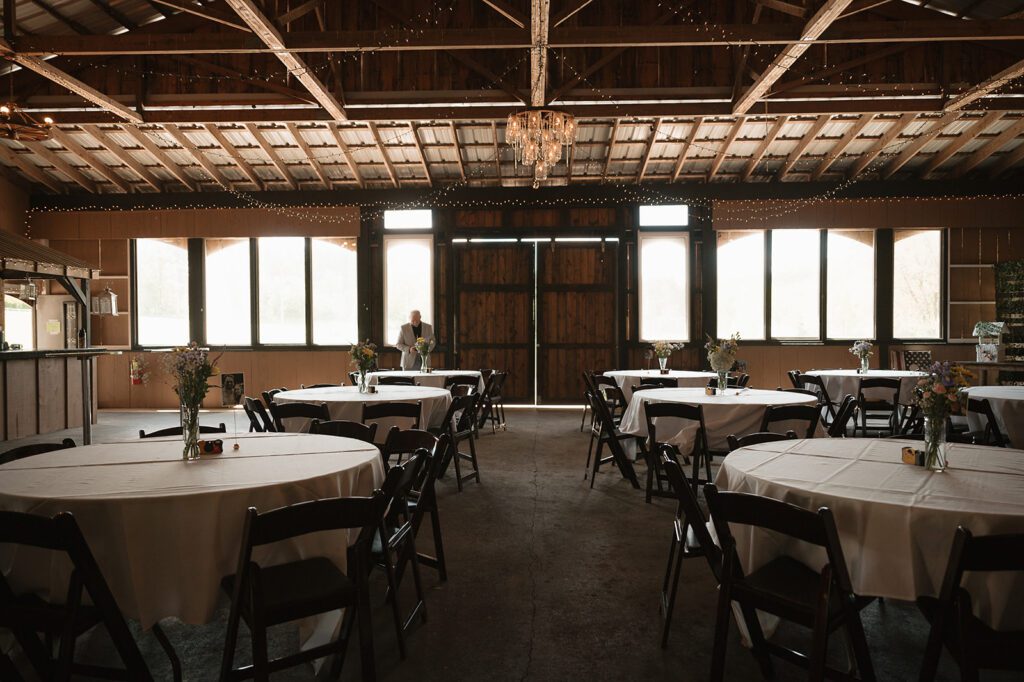 The front half of the Buckhorn Barn set with round tables for a wedding reception
