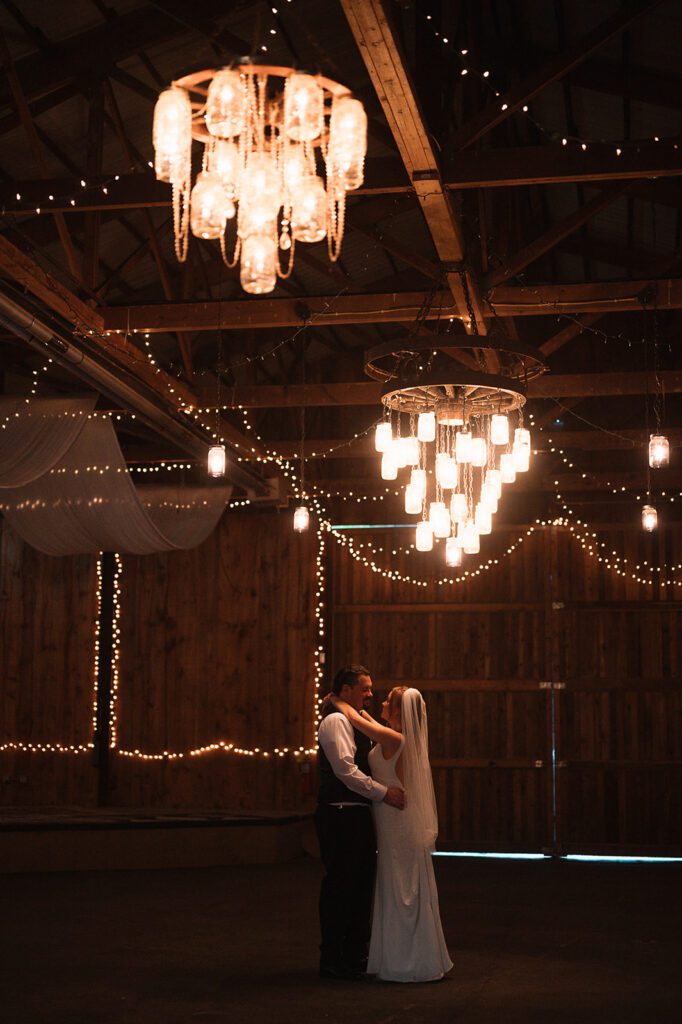 A first dance beneath the chandeliers in the Buckhorn Barn