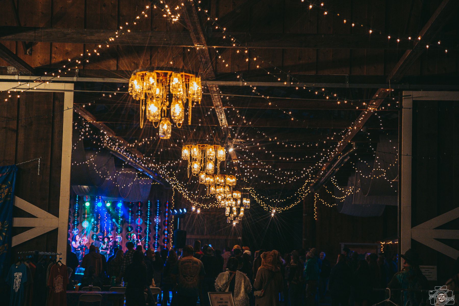 String lights and chandeliers over the dance floor in Buckhorn Barn
