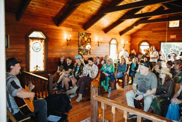 An acoustic set inside Saint Rose Chapel, every pew full